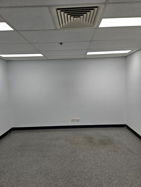Fresh white office walls completed during an Amazon commercial repaint in Brisbane