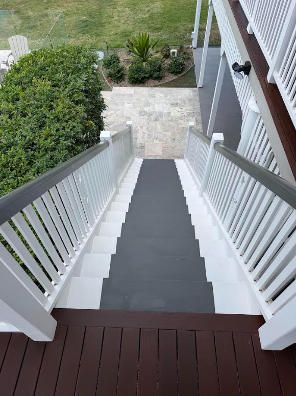 Exterior timber staircase after repainting in grey, white and timber tones
