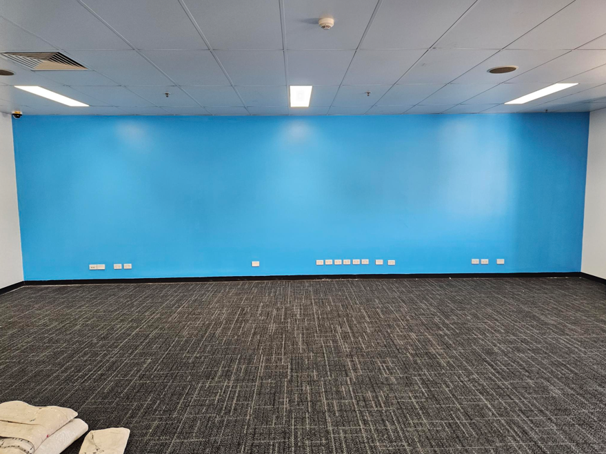 Blue feature wall completed for an Amazon office repaint in Brisbane